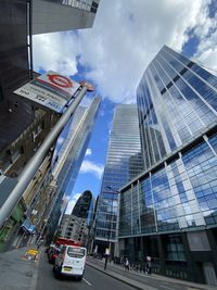 Modern buildings in city against sky