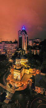 High angle view of illuminated buildings in city at night