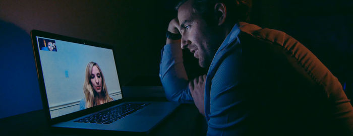 Man using laptop at home