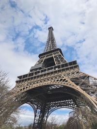 Low angle view of tower against cloudy sky