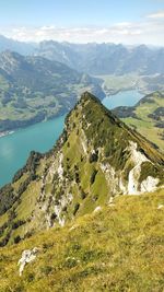 Scenic view of landscape and mountains against sky