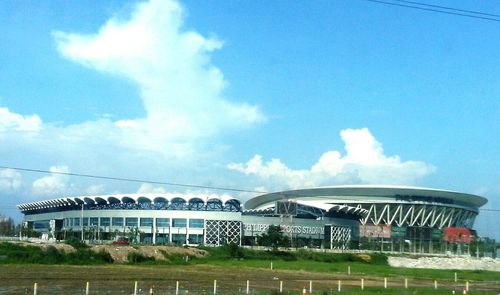 Built structure against blue sky and clouds