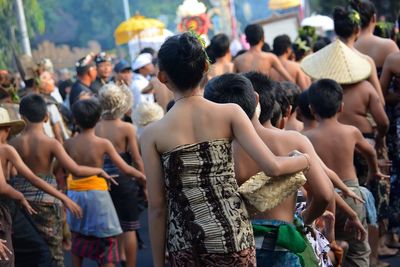 People standing on street during carnival