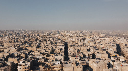 Aerial view of townscape against clear sky
