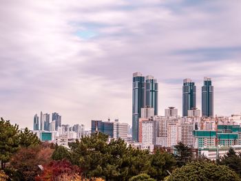 Modern cityscape against sky