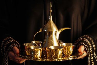 Close-up of hand holding turkish tea cup