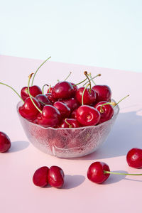 Close-up of fresh, juicy cherries in a glass bowl. seasonal, summer berries and fruits.