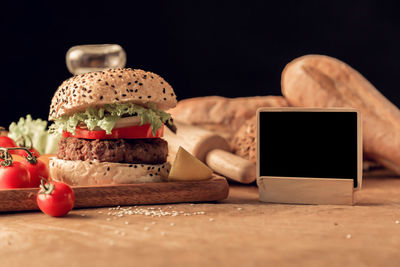 Close-up of cake on table against black background