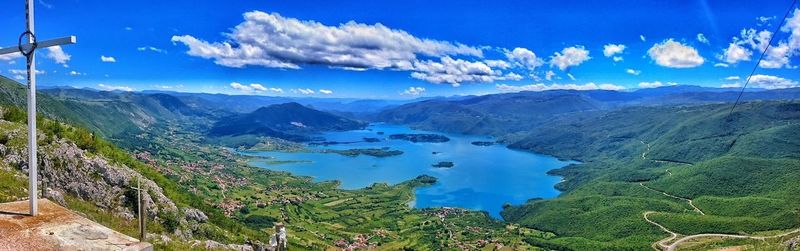 Panoramic view of mountains against cloudy sky