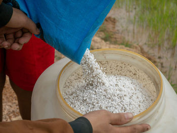 Midsection of person preparing food