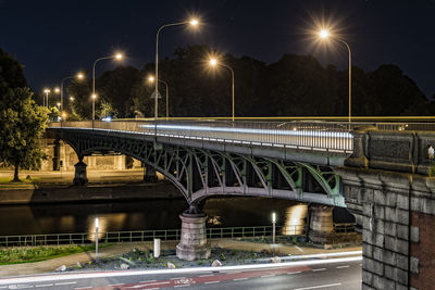 Illuminated old bridge by night