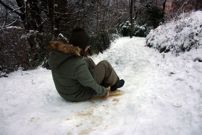 Sledding along a trail covered with white snow in the mountains in winter or maybe cold spring