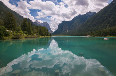 Scenic view of lake and mountains against sky