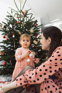Portrait of girl with christmas tree