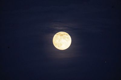Low angle view of moon against sky at night