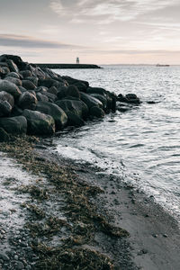 Scenic view of sea against sky at sunset