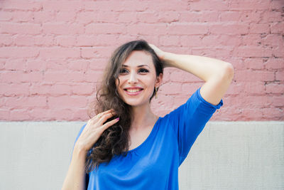 Woman standing against wall