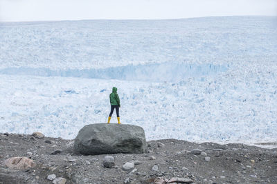 Woman looking at glacier