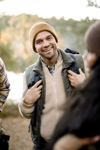 Portrait of smiling man with friends during staycation