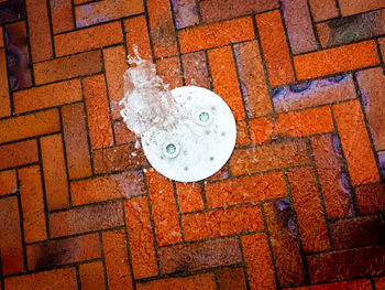 High angle view of manhole on street