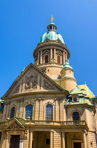 Low angle view of building against blue sky