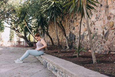 Side view of woman sitting 