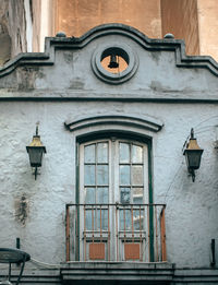 Low angle view of street light against building