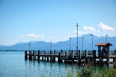 Pier over lake against sky