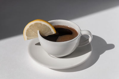 Close-up of coffee cup on table