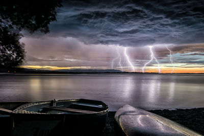 Scenic view of sea against storm clouds