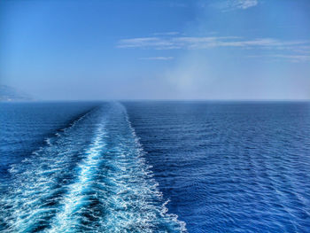 Scenic view of sea against blue sky