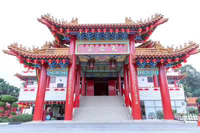 Entrance of temple against building