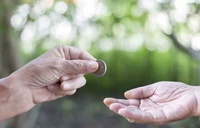 Close-up of couple holding hands