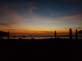 Scenic view of beach against sky during sunset