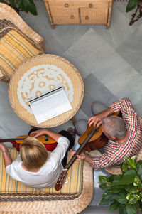 High angle view of people sitting in basket on table