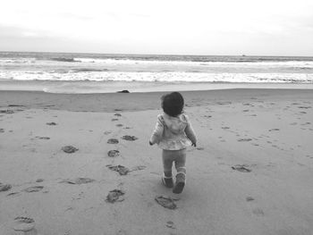 Woman standing on beach