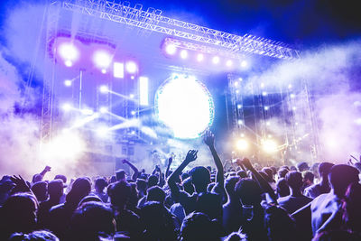 Crowd enjoying at music concert