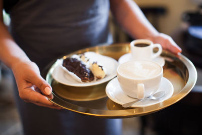 A mug of cappuccino with a picture brought by the waiter