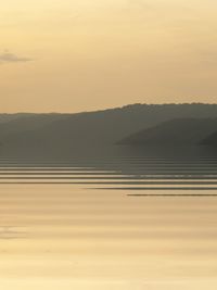 Scenic view of landscape against sky during sunset