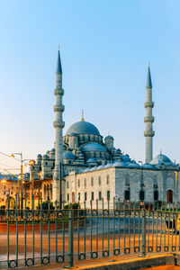 View of mosque against clear blue sky