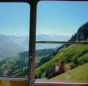 Scenic view of landscape seen through car window