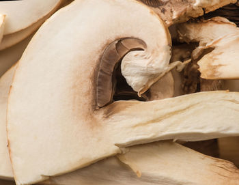 Close-up of sliced mushrooms, ingredients for pizza and roast.