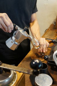 Midsection of man preparing food