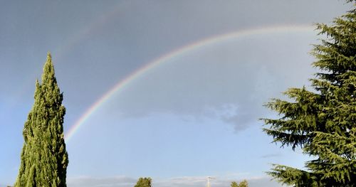 Low angle view of rainbow against sky