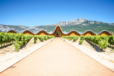 Scenic view of mountains against clear blue sky