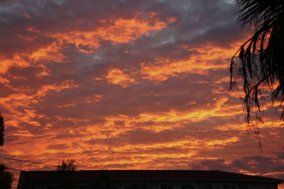 Low angle view of dramatic sky during sunset
