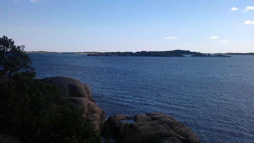 Scenic view of sea against blue sky