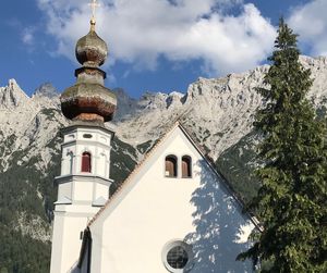 Panoramic view of building and mountains against sky