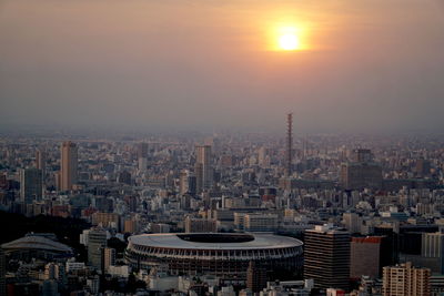 High angle view of buildings against sky during sunset