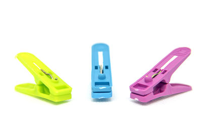 Close-up of colored pencils over white background